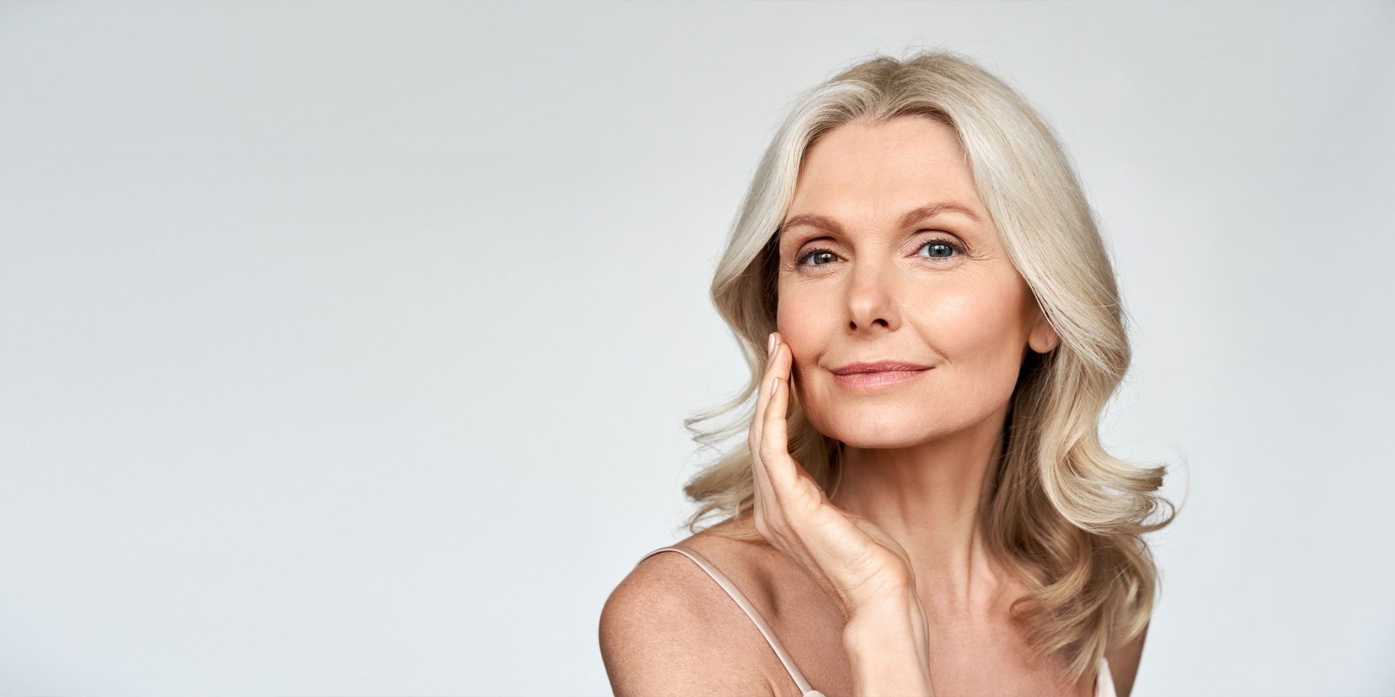 beautiful mature botox model smiling for their photoshoot