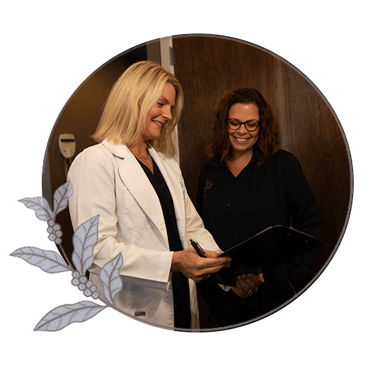 patient and doctor going over dental veneer procedure information within the dental center