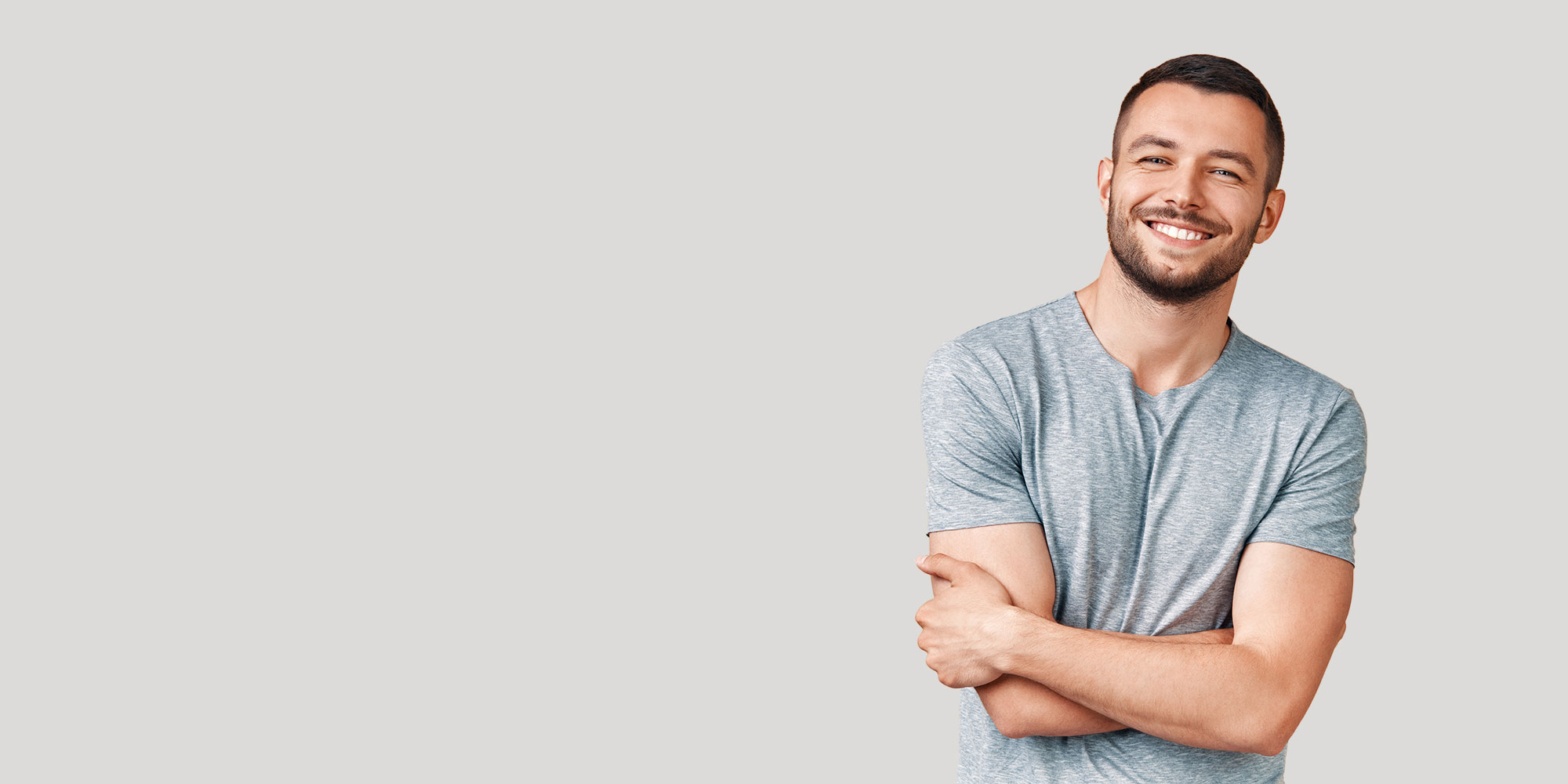 handsome veneer patient smiling brightly for their photo shoot
